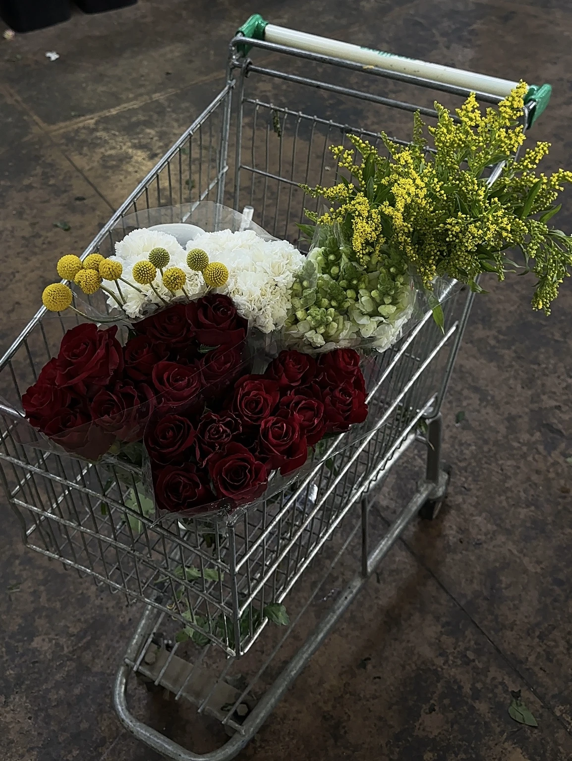 A considered selection of roses, carnations and accent flowers during sourcing for Grace Blooms